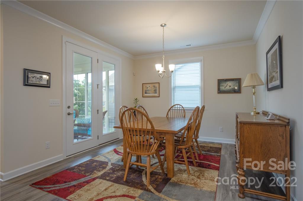 1213 Independence Street Tega Cay, SC 29708 - Photo 14 of 35 a view of a dining room with furniture and wooden floor