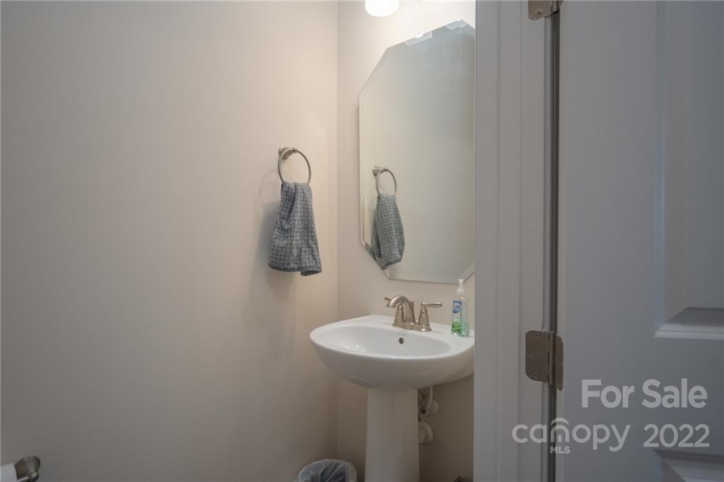 1213 Independence Street Tega Cay, SC 29708 - Photo 16 of 35 a bathroom with a sink and mirror