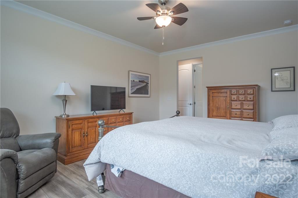 1213 Independence Street Tega Cay, SC 29708 - Photo 20 of 35 a bedroom with a bed and couch