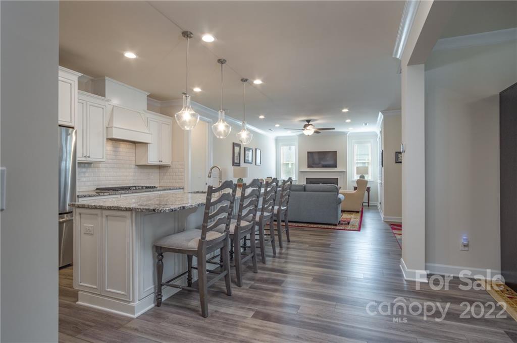 1213 Independence Street Tega Cay, SC 29708 - Photo 7 of 35 a kitchen with a table and chairs in it