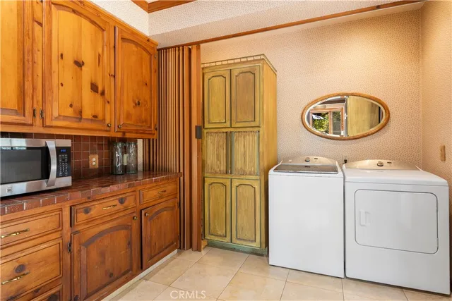 a white toilet sitting next to a bath tub