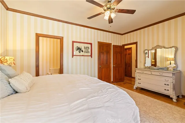 a bathroom with a toilet and a shower curtain
