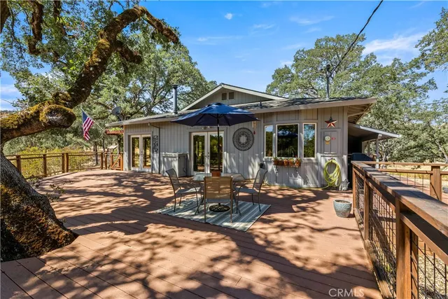 a view of a house with a yard and garage