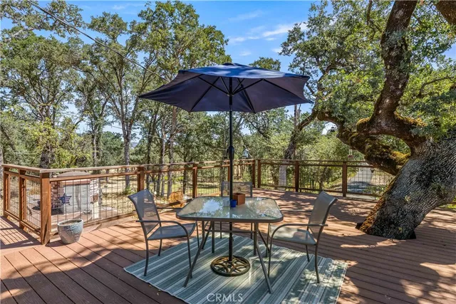 a bedroom with a bed and a flat tv screen on the dresser