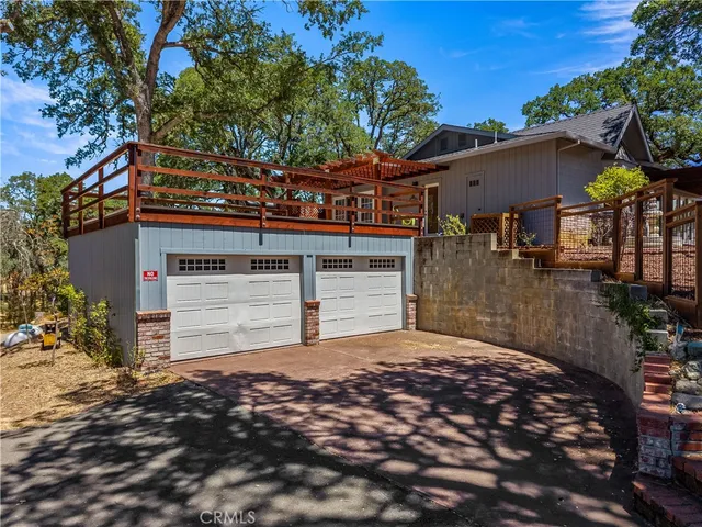 a living room with furniture flat screen tv and a large window