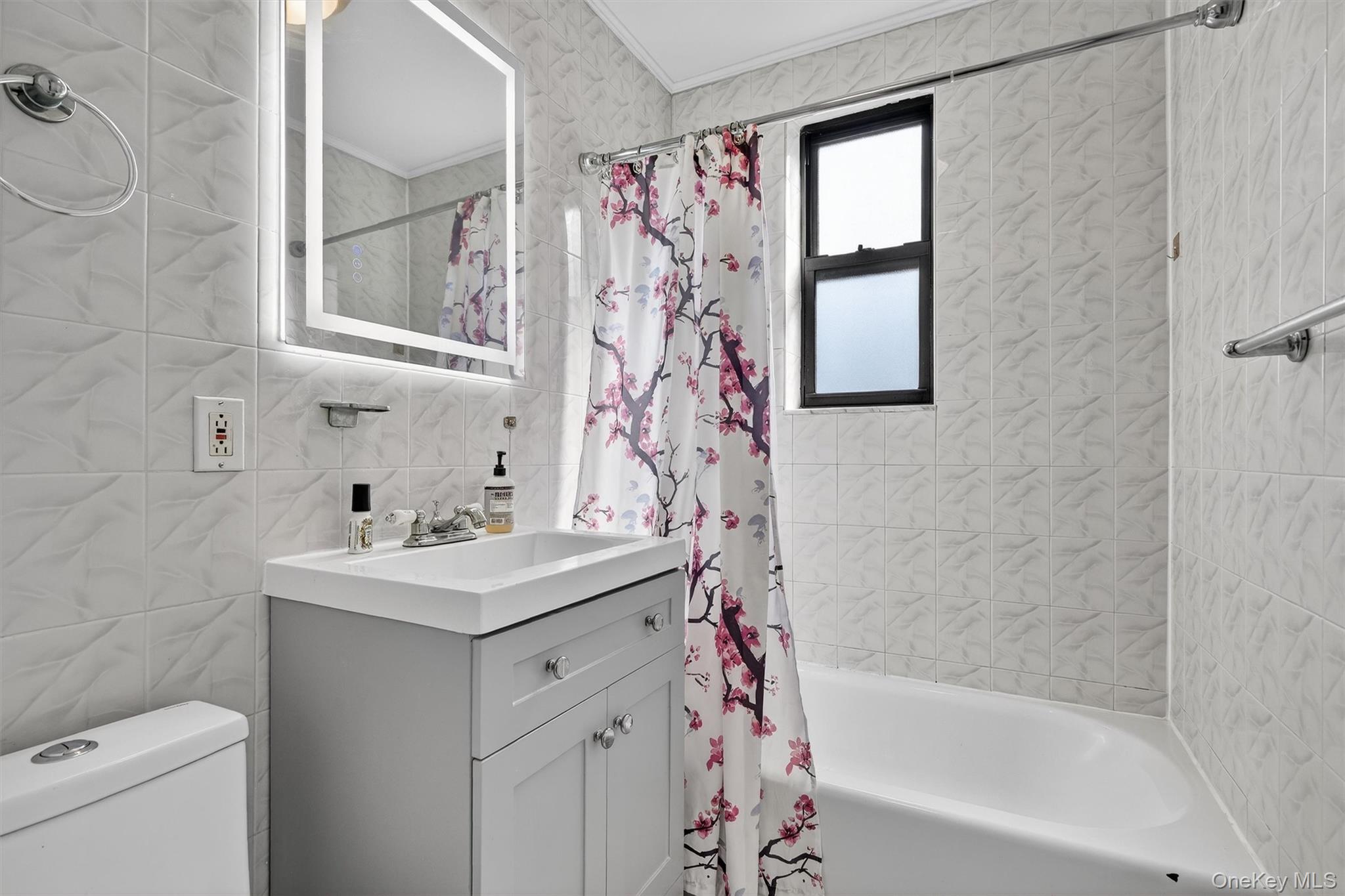 5235 Post Road, Unit 5A Bronx, NY 10471 - Photo 18 of 23 Updated bathroom with new vanity and mirror.