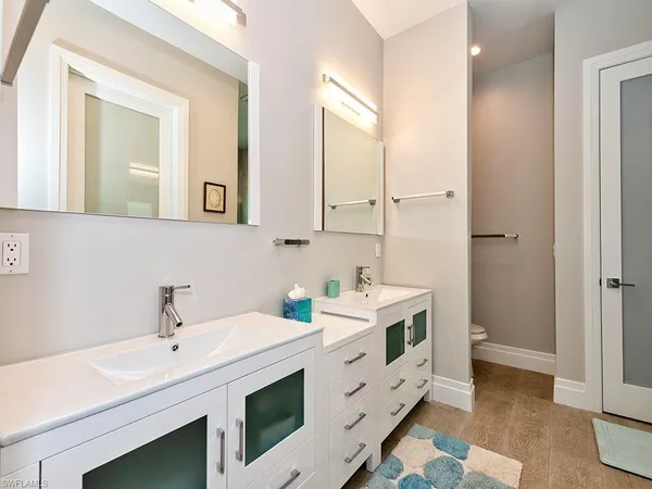 a view of bathroom with dual sinks