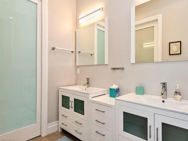 a view of a bathroom from a corridor