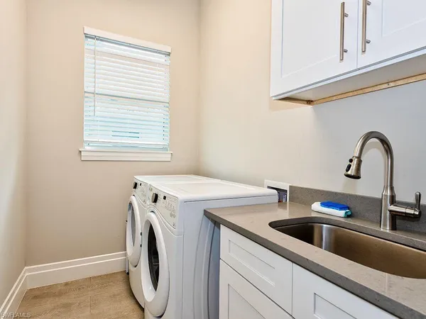 a bedroom with bed and a window