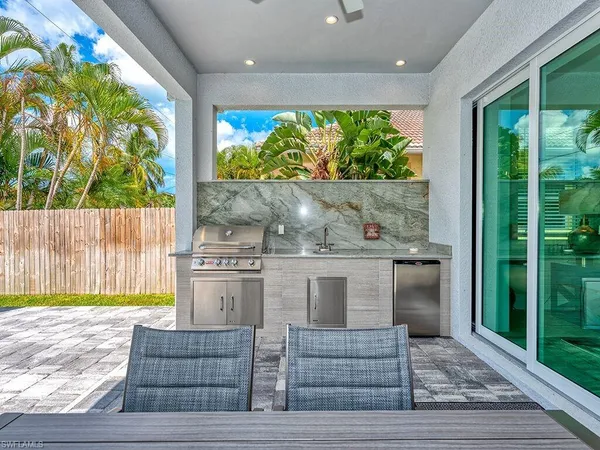 a kitchen with a stove and a sink