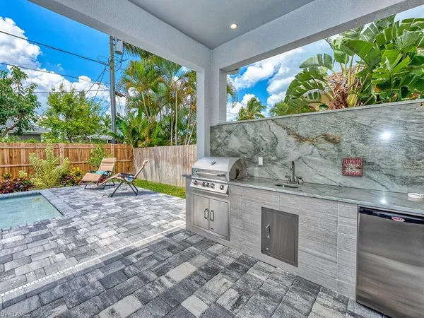 a view of a chairs and table in the patio