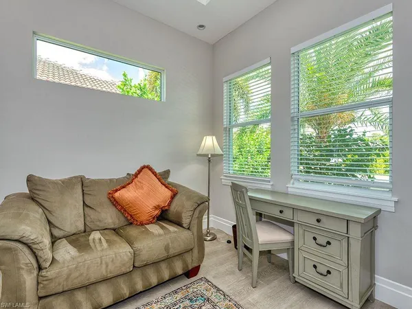 a living room with furniture and a window