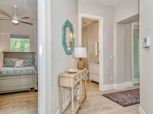 a view of an entryway with furniture and mirror