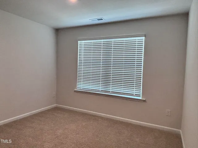 a view of a room that has a window in it