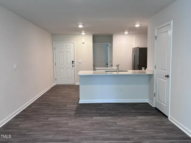 a view of kitchen with wooden floor