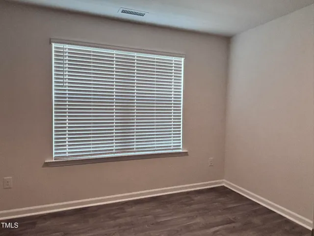 a view of a room that has a window and a window