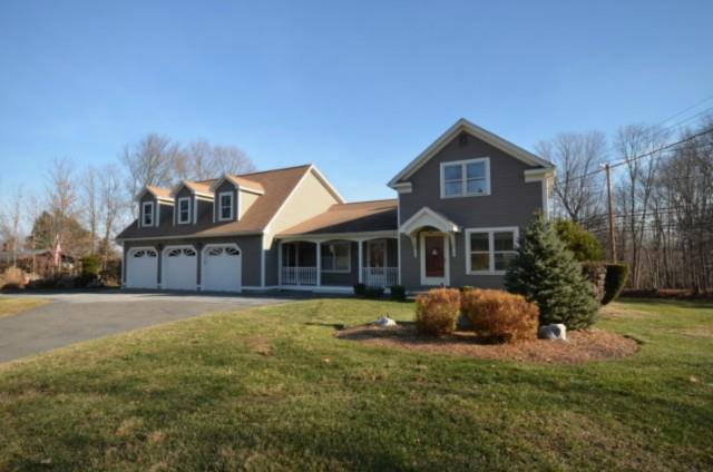 140 Isinglass Road Shelton, CT 06484 - Photo 1 of 1 a front view of a house with a yard and garage