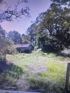 a fire hydrant in the middle of a field