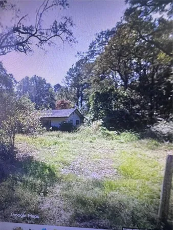a fire hydrant in the middle of a field