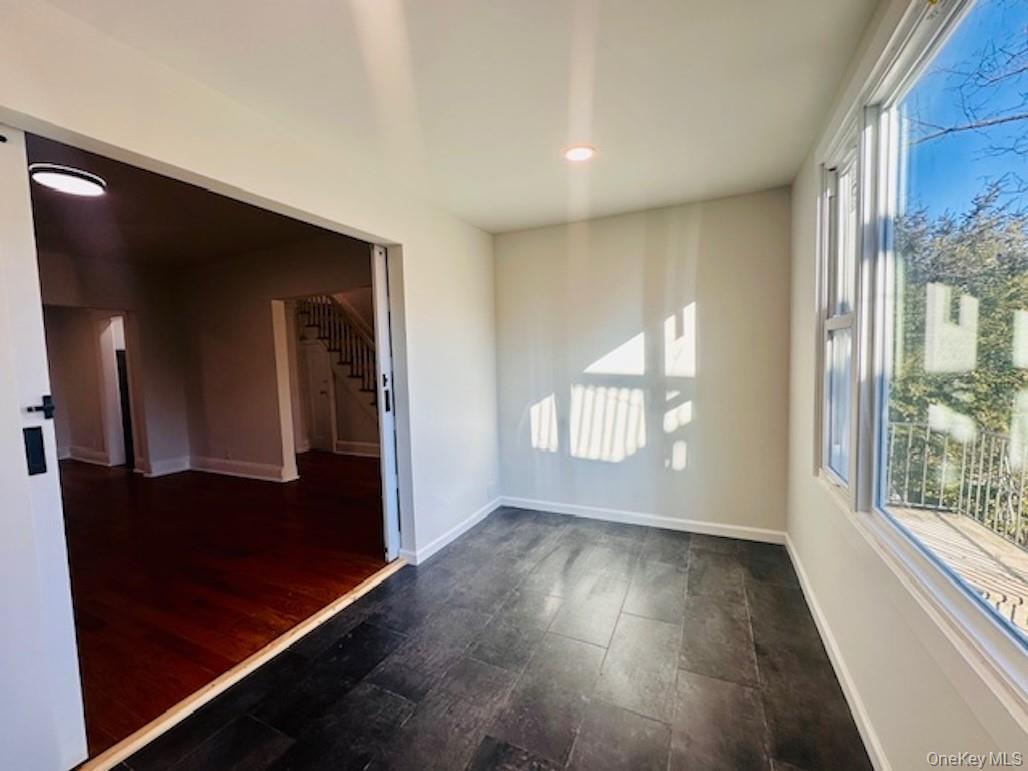 5517 Fieldston Road Bronx, NY 10471 - Photo 14 of 28 a view of empty room with wooden floor and fan