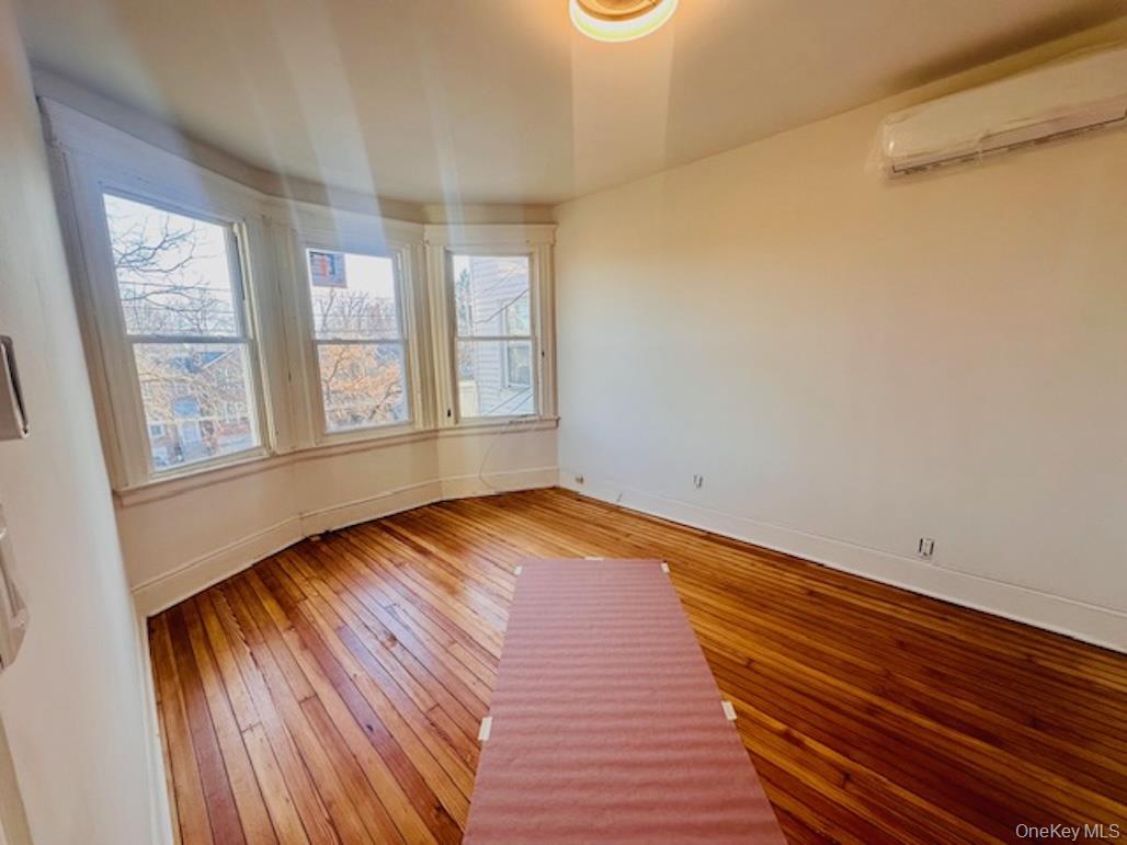 5517 Fieldston Road Bronx, NY 10471 - Photo 20 of 28 a view of empty room with wooden floor and fan