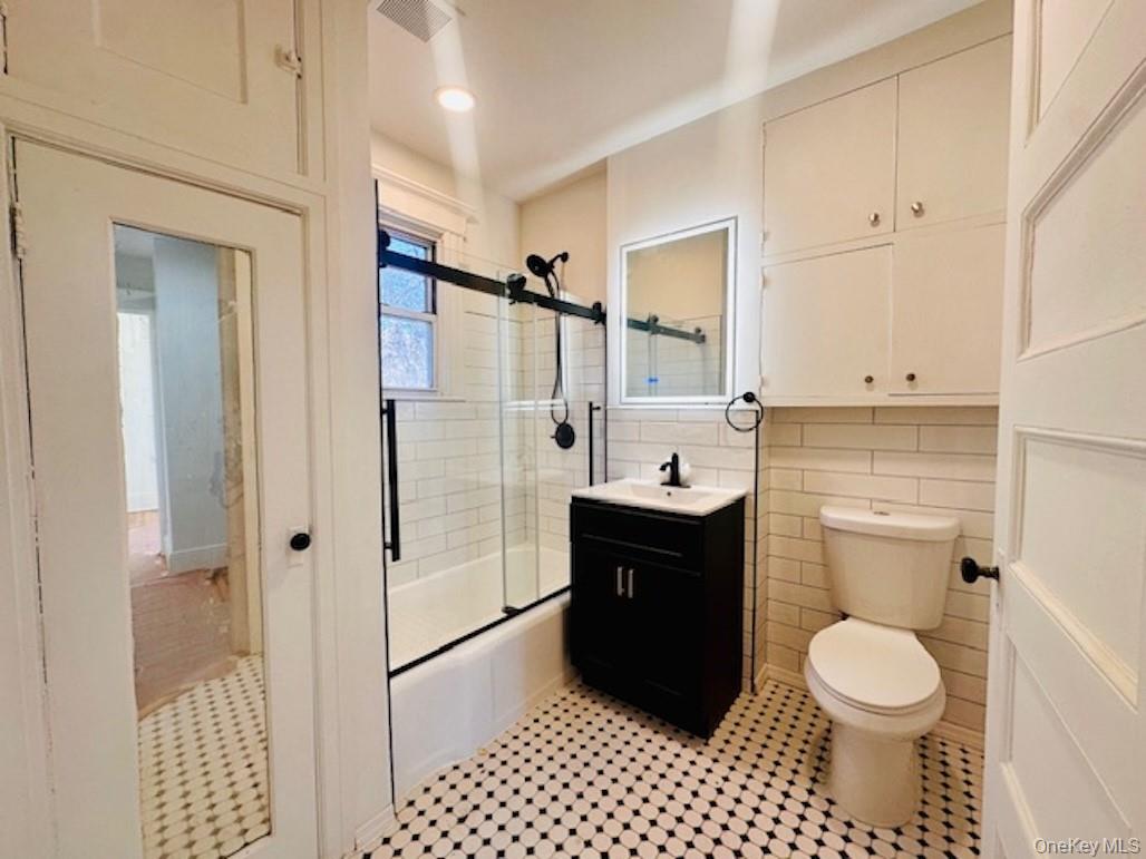 5517 Fieldston Road Bronx, NY 10471 - Photo 21 of 28 a bathroom with a sink toilet and shower