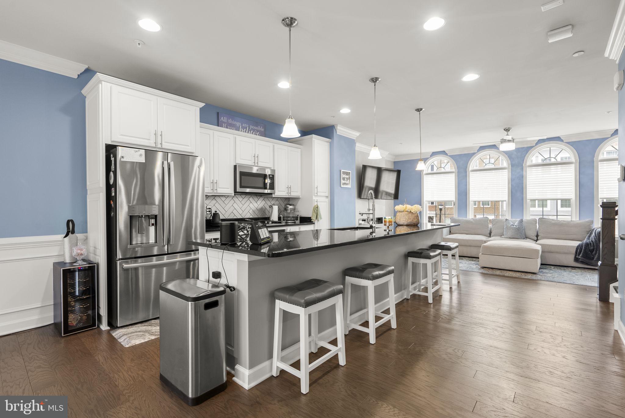 3043 Mia Lane Bowie, MD 20721 - Photo 12 of 44 a large kitchen with a table and chairs