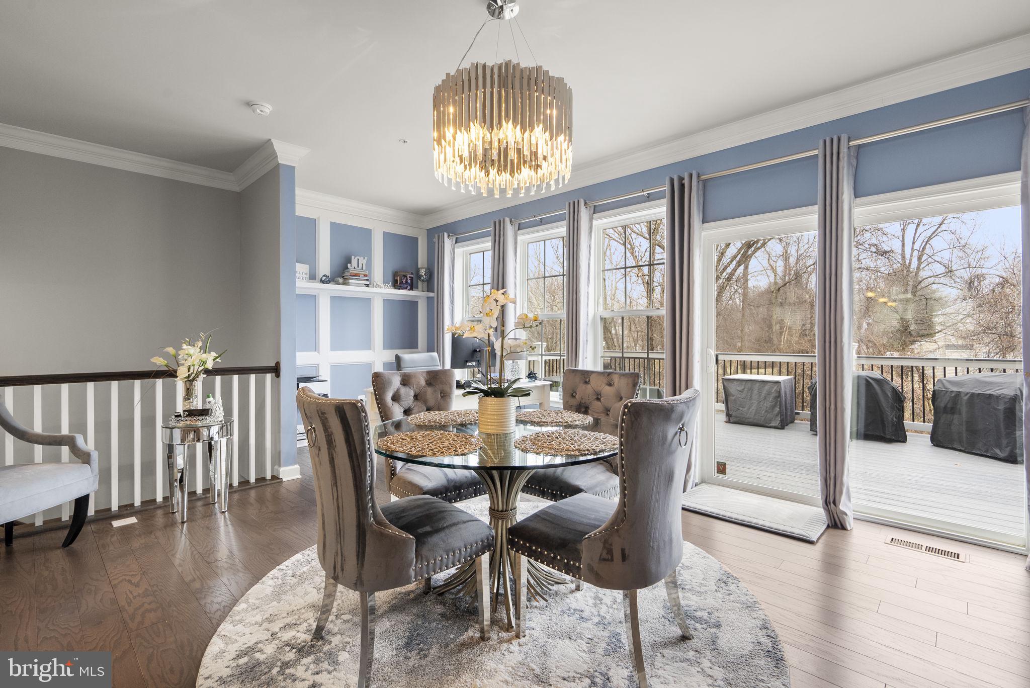 3043 Mia Lane Bowie, MD 20721 - Photo 16 of 44 a dining room with furniture a chandelier and wooden floor