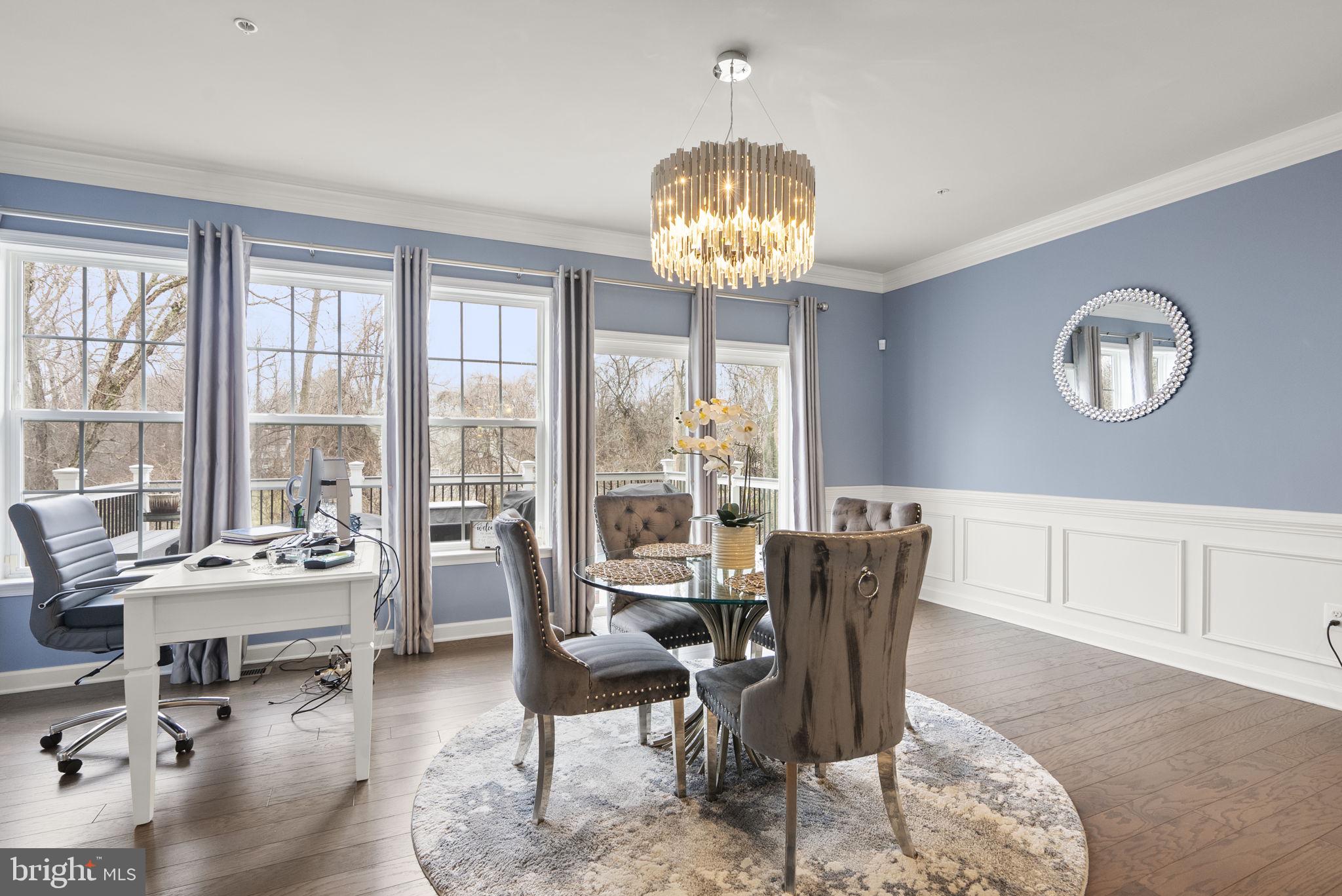 3043 Mia Lane Bowie, MD 20721 - Photo 17 of 44 a view of a dining room with furniture a chandelier and wooden floor