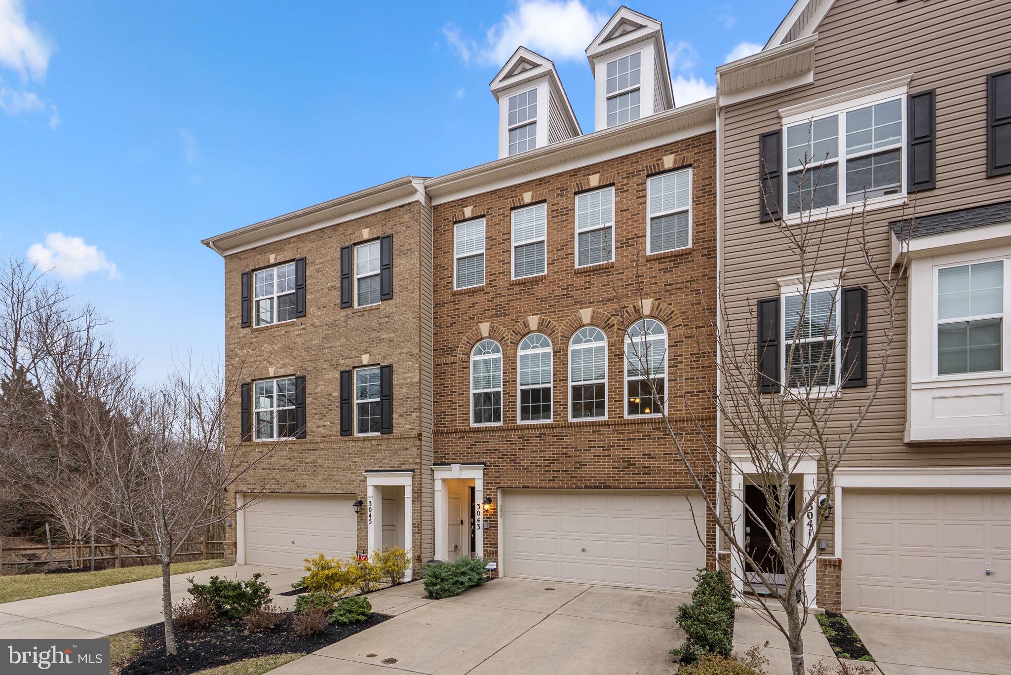 3043 Mia Lane Bowie, MD 20721 - Photo 2 of 44 a front view of a house with many windows