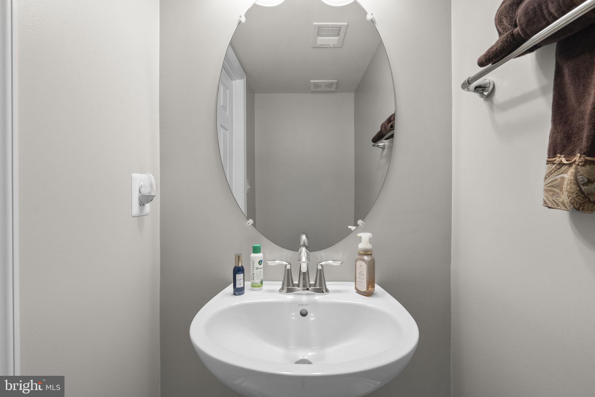 3043 Mia Lane Bowie, MD 20721 - Photo 21 of 44 a bathroom with a sink and a mirror