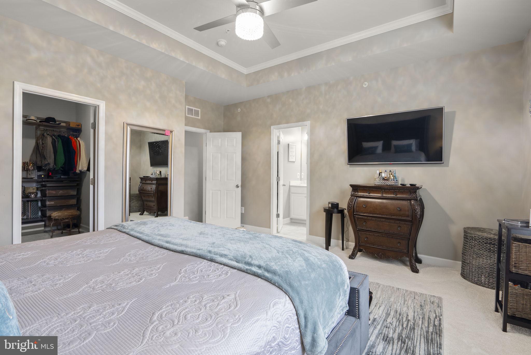 3043 Mia Lane Bowie, MD 20721 - Photo 25 of 44 a bedroom with a bed and a flat screen tv