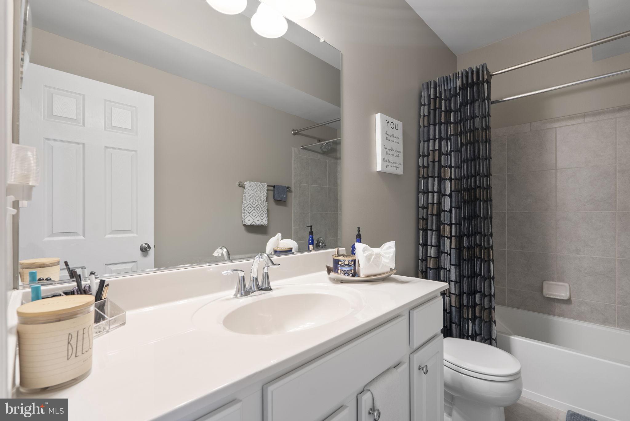 3043 Mia Lane Bowie, MD 20721 - Photo 34 of 44 a bathroom with a sink toilet vanity and shower