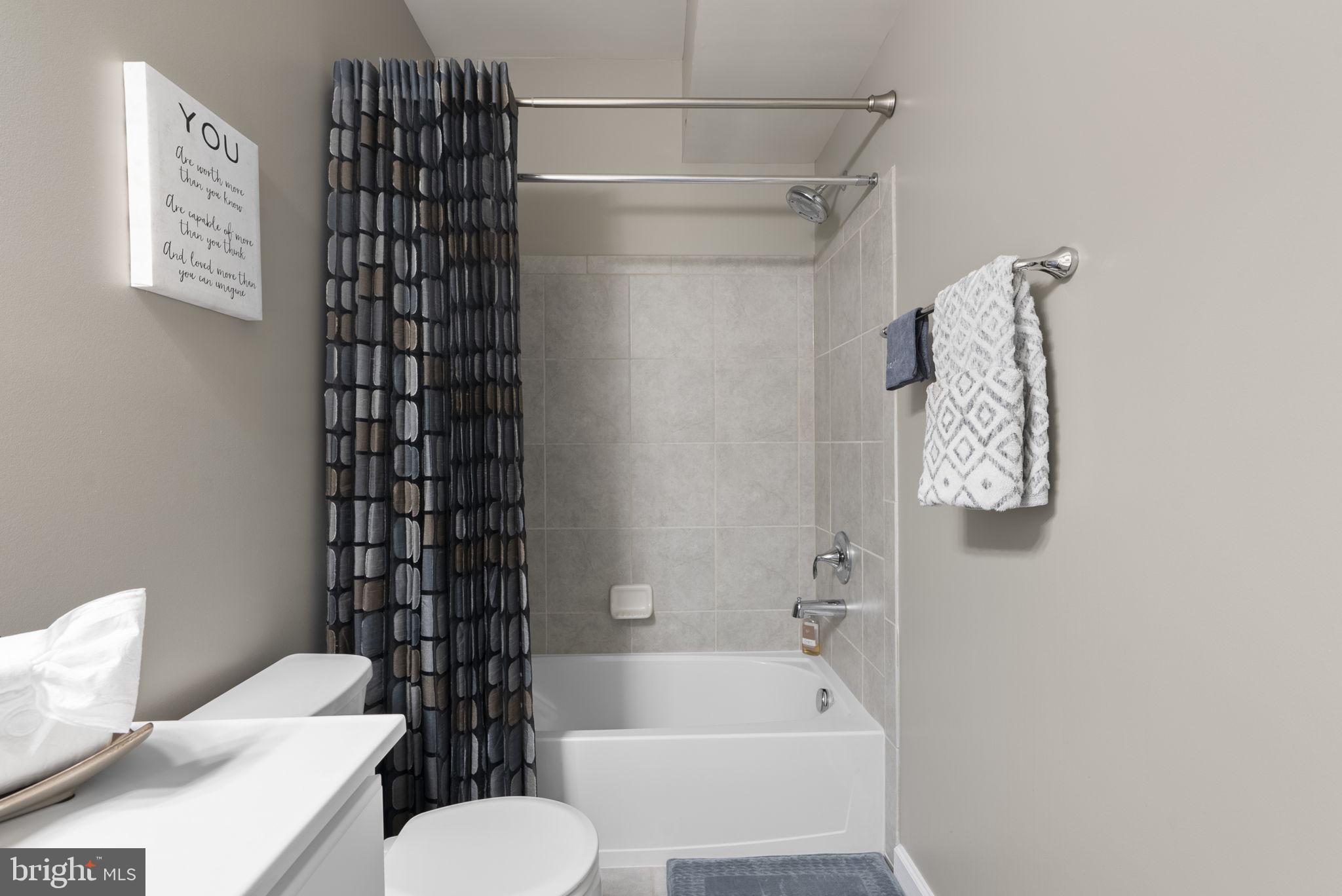 3043 Mia Lane Bowie, MD 20721 - Photo 35 of 44 a bathroom with a toilet and shower