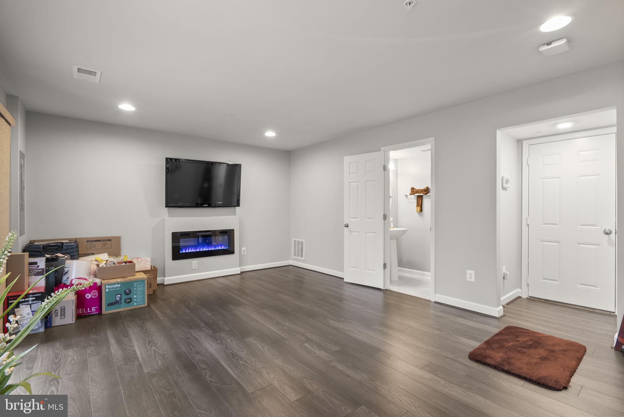 3043 Mia Lane Bowie, MD 20721 - Photo 37 of 44 a living room with furniture and a flat screen tv