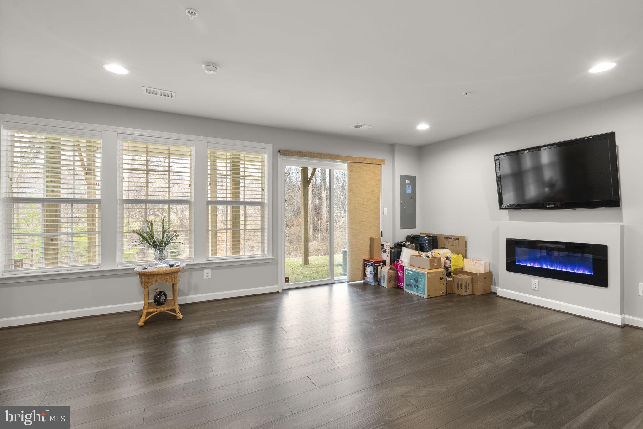3043 Mia Lane Bowie, MD 20721 - Photo 38 of 44 a living room with fireplace furniture and a flat screen tv