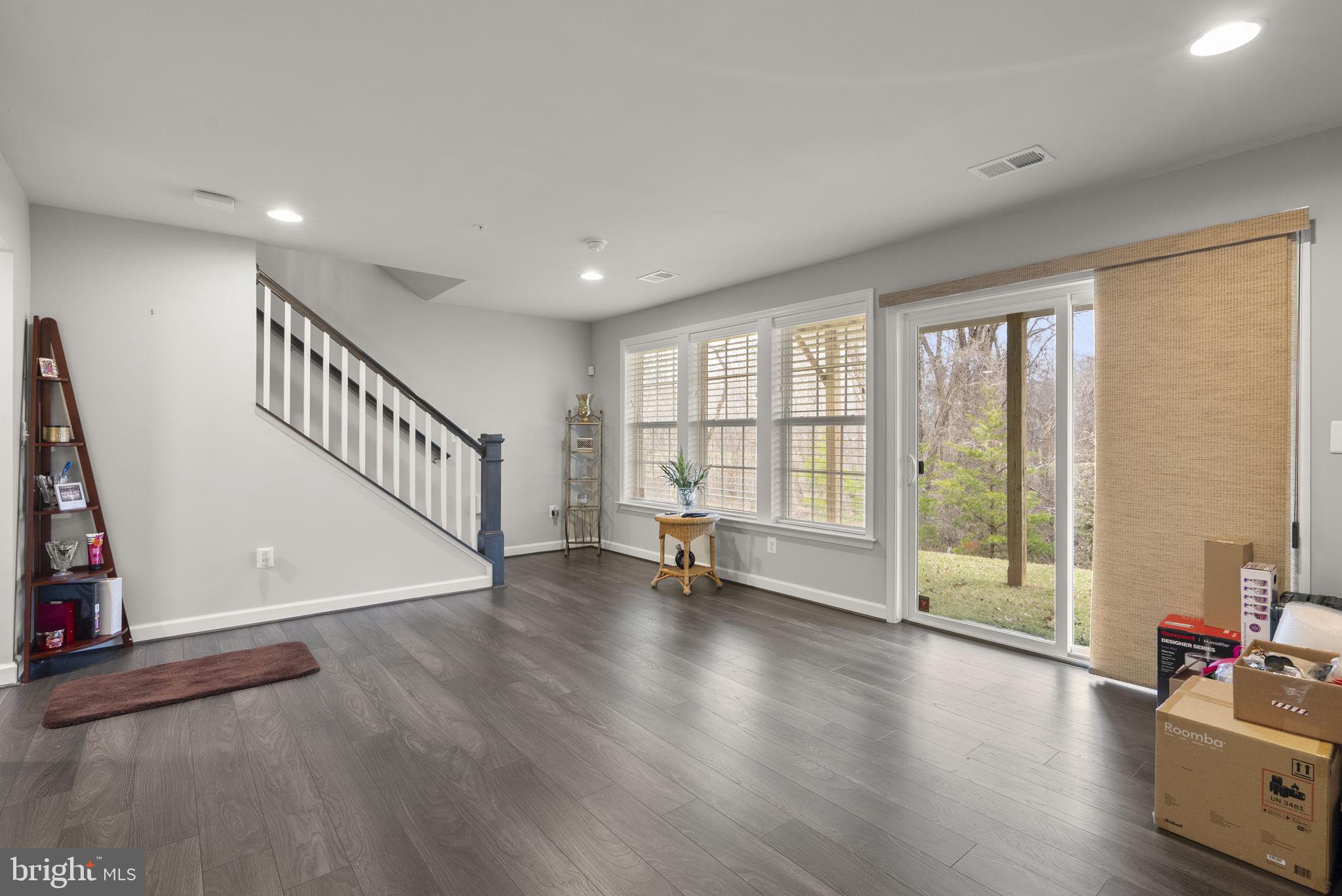 3043 Mia Lane Bowie, MD 20721 - Photo 39 of 44 a view of an empty room with wooden floor and a window