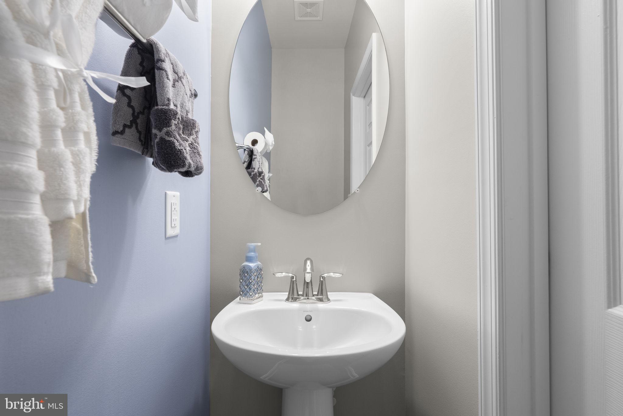 3043 Mia Lane Bowie, MD 20721 - Photo 40 of 44 a bathroom with a sink and mirror