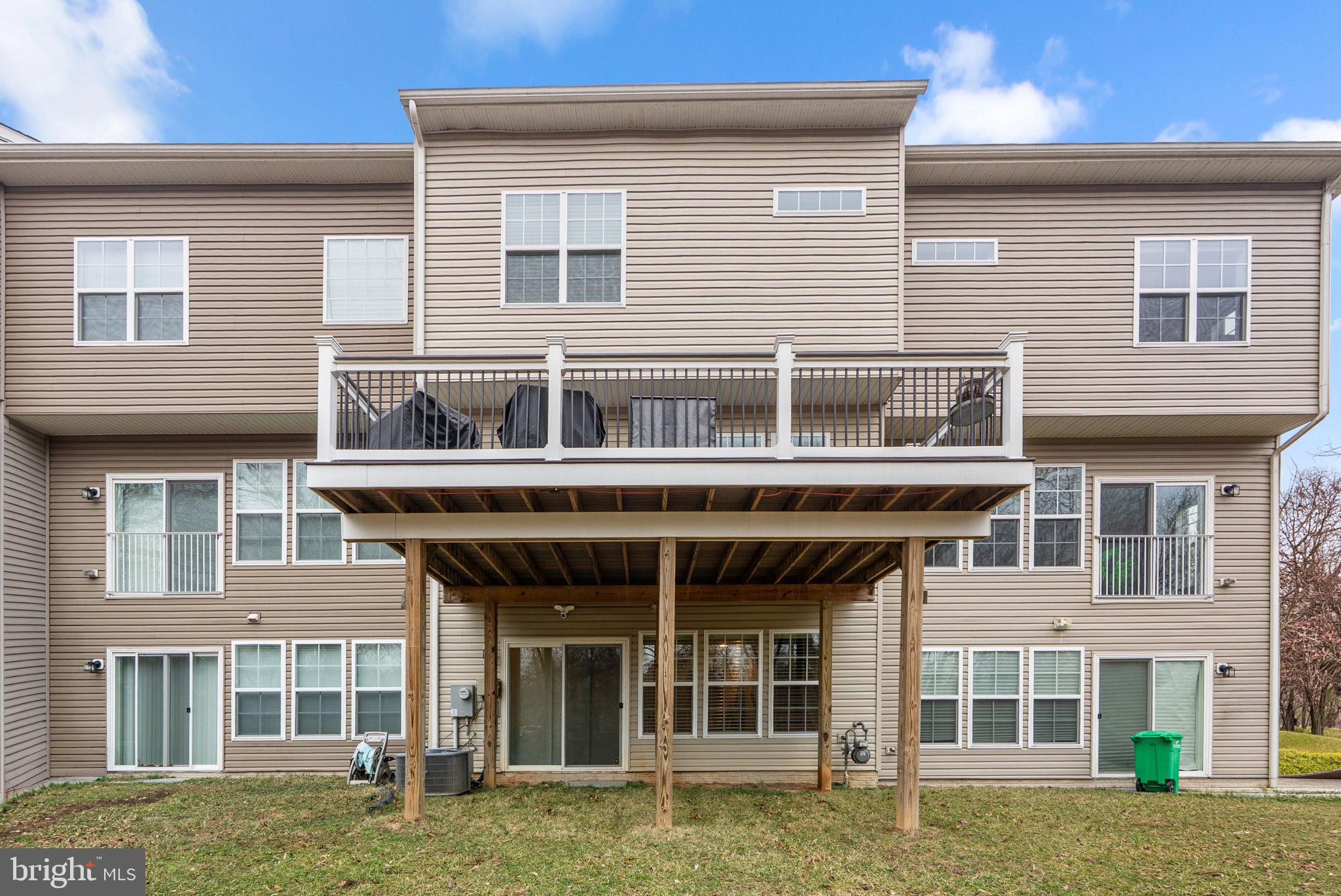 3043 Mia Lane Bowie, MD 20721 - Photo 42 of 44 a front view of a building with a garden