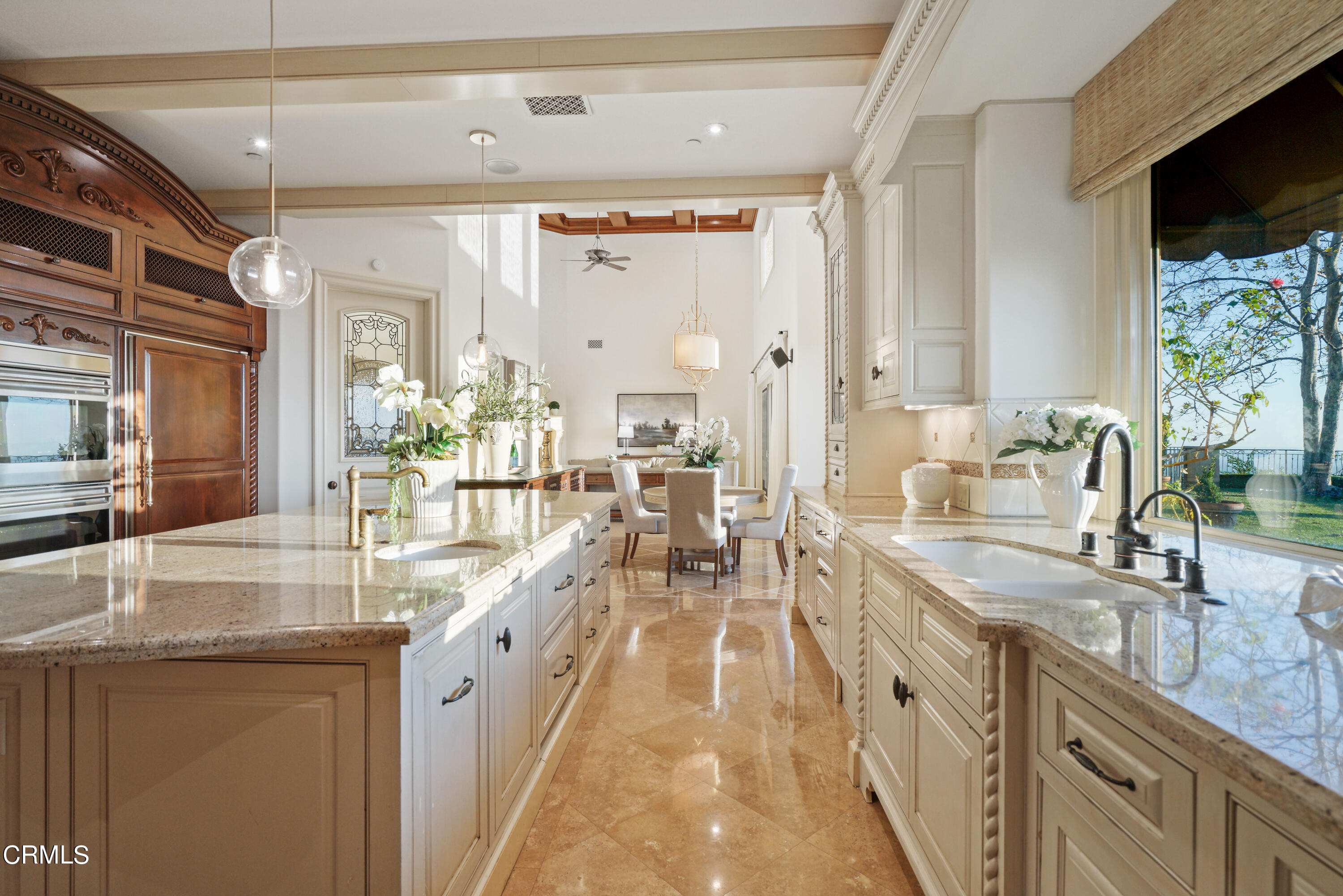2323 Crystal Lane Pasadena, CA 91107 - Photo 21 of 72 a large white kitchen with kitchen island granite countertop a large window and a sink