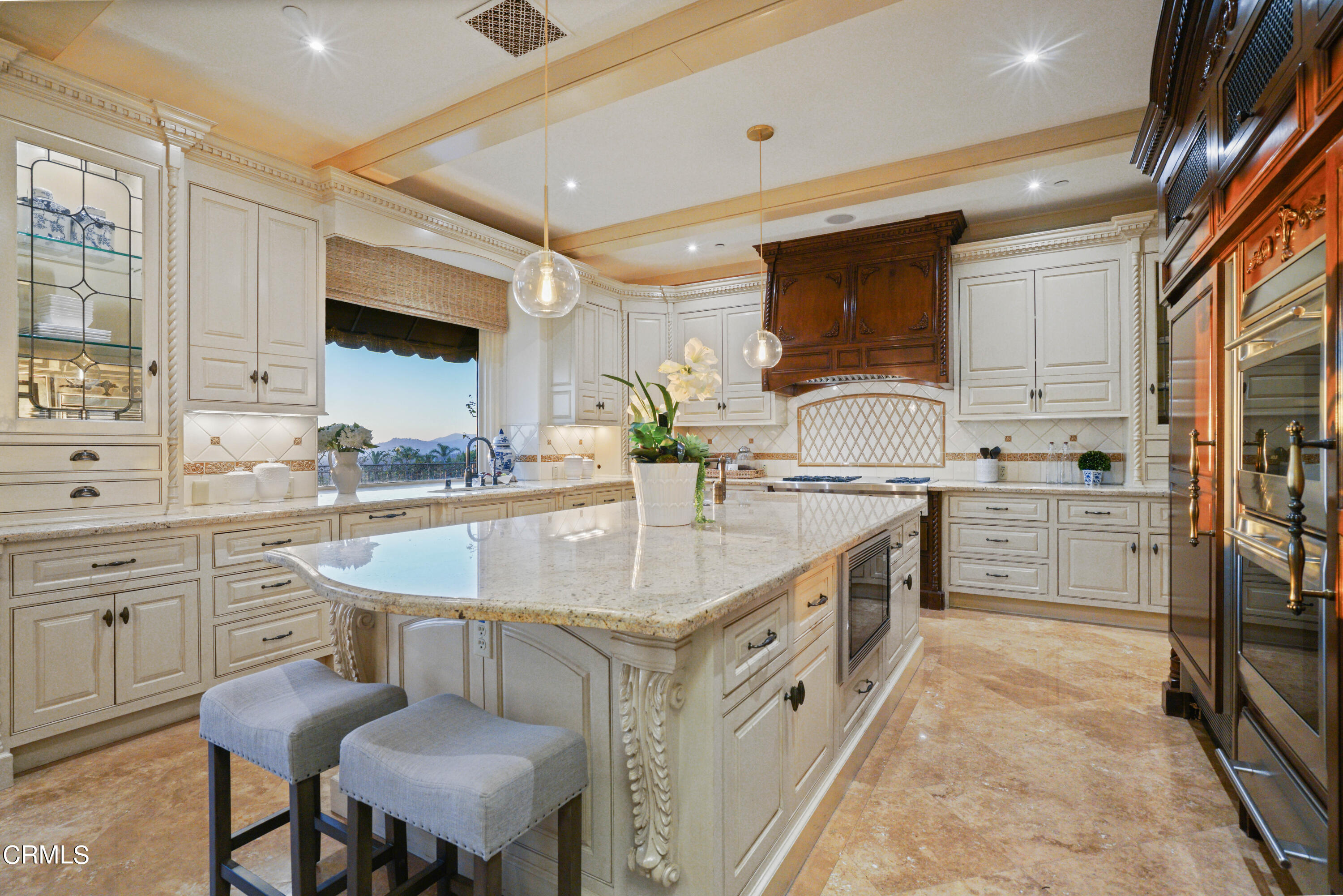 2323 Crystal Lane Pasadena, CA 91107 - Photo 22 of 72 a kitchen with stainless steel appliances kitchen island granite countertop a sink and cabinets