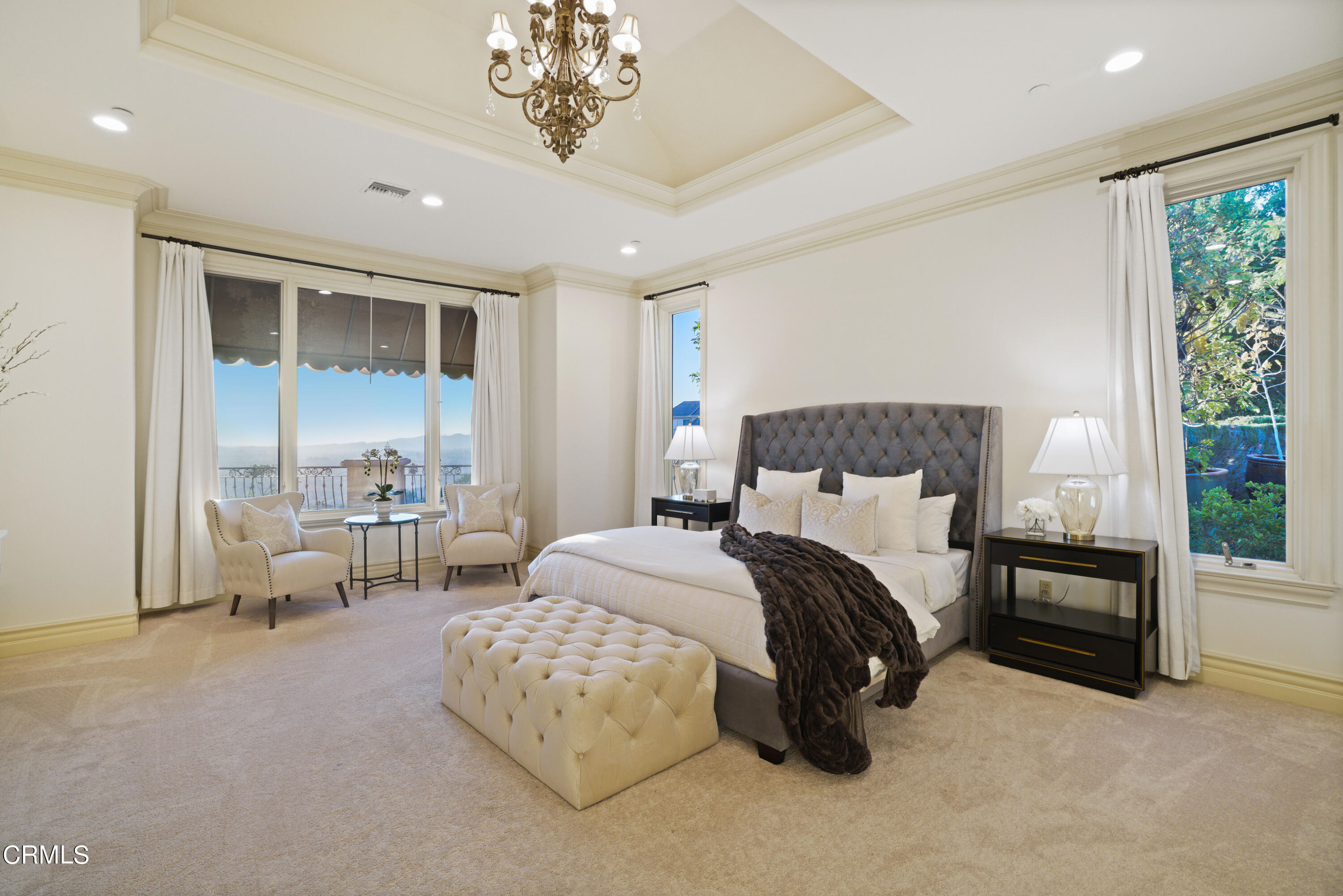 2323 Crystal Lane Pasadena, CA 91107 - Photo 34 of 72 a spacious bedroom with a bed and a chandelier