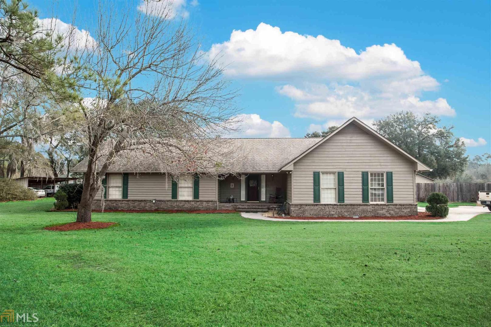 178 Center Drive Rincon, GA 31326 - Photo 1 of 1 a front view of house with a garden