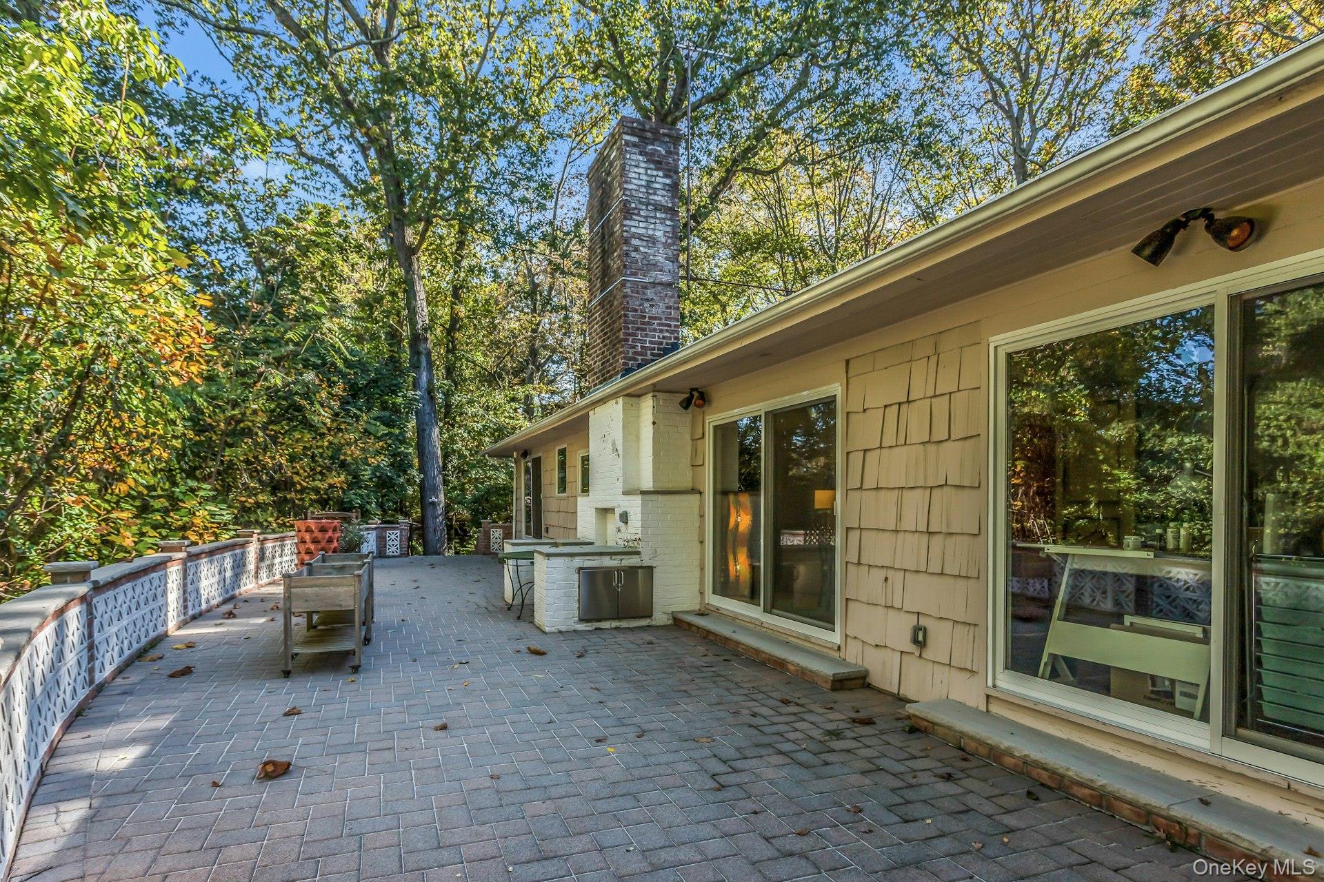 31 Knolls Lane Manhasset, NY 11030 - Photo 19 of 27 a view of backyard with seating space