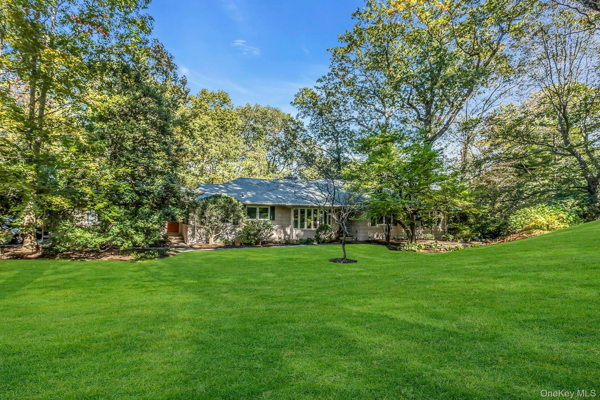 31 Knolls Lane Manhasset, NY 11030 - Photo 2 of 27 a view of a trees in a yard