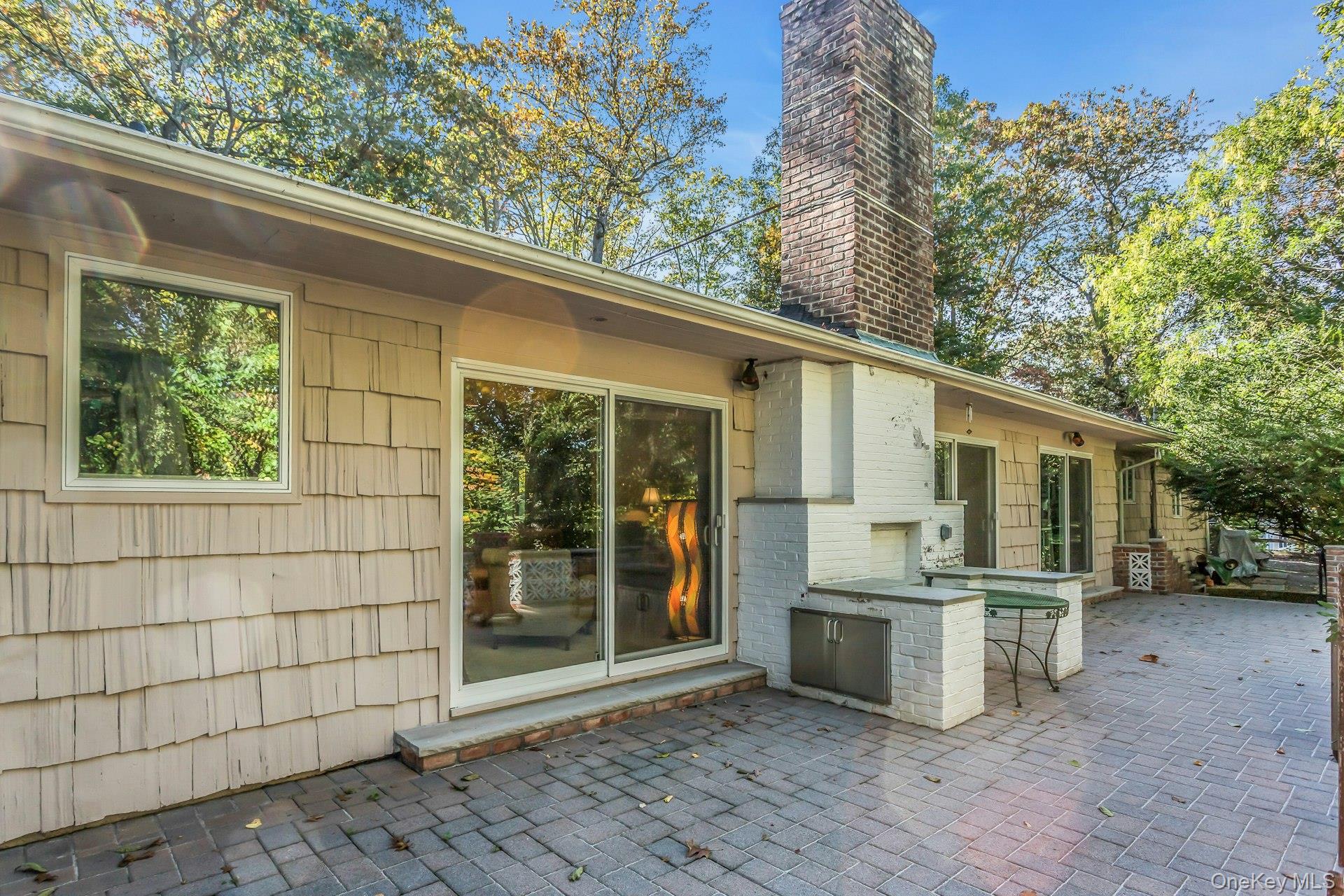 31 Knolls Lane Manhasset, NY 11030 - Photo 21 of 27 a view of a house with a outdoor space