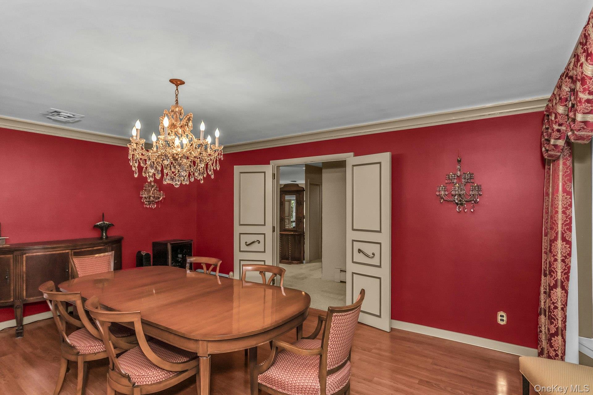 31 Knolls Lane Manhasset, NY 11030 - Photo 10 of 27 a view of a dining room with furniture and chandelier