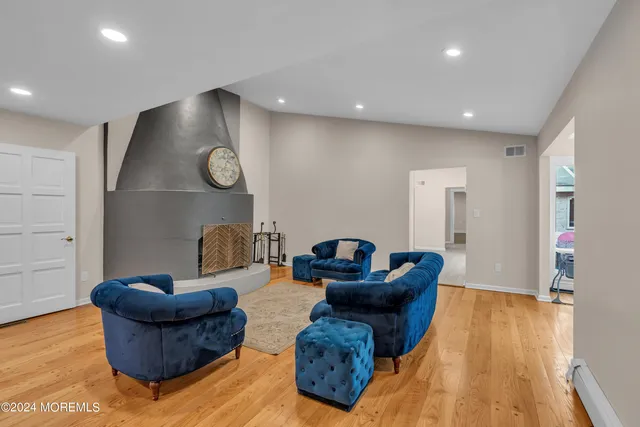 a kitchen with stainless steel appliances granite countertop a stove oven and a refrigerator with white cabinets