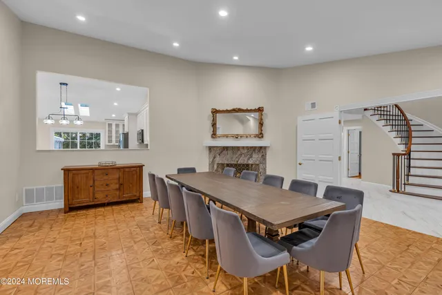 a bedroom with two beds and a ceiling fan