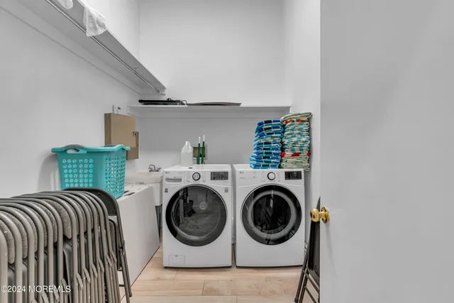 a living room with furniture and a ceiling fan